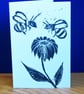 Bees on a flower - Lino print, black ink on white card.