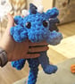 Plush crocheted dragon lovey, soft cuddly toy