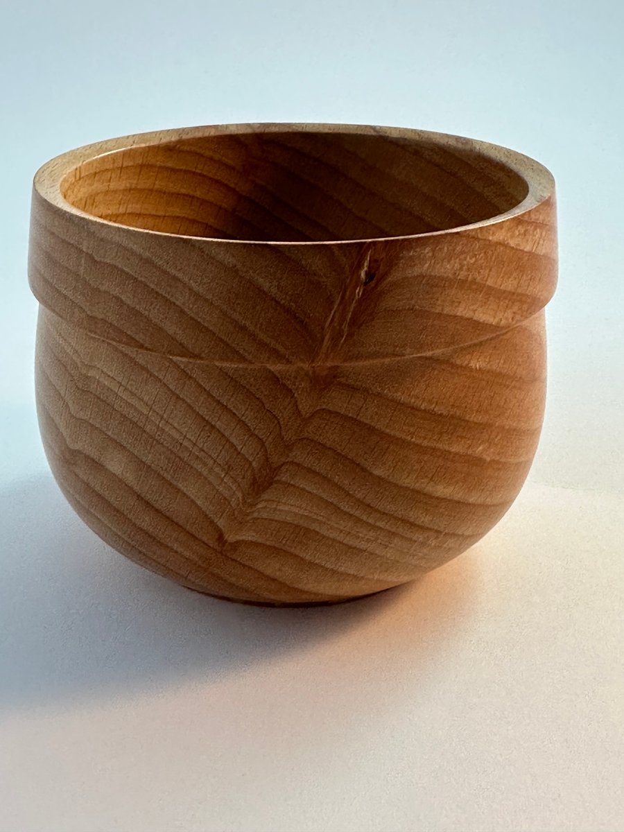A small beech wooden bowl