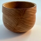 A small beech wooden bowl