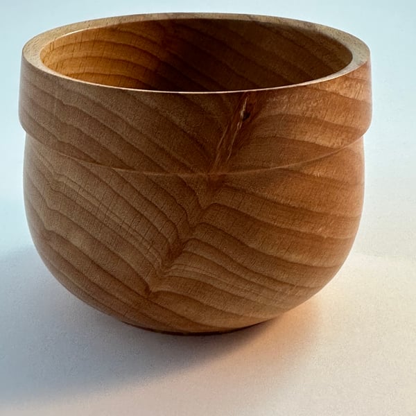 A small beech wooden bowl