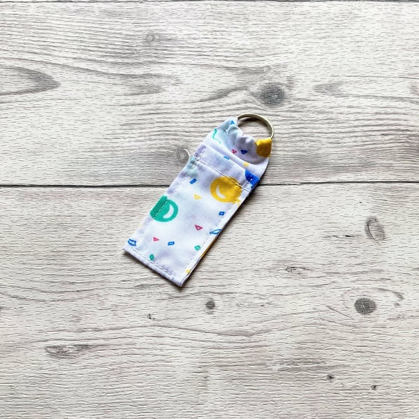Balloons lip balm white polycotton fabric keyring. 