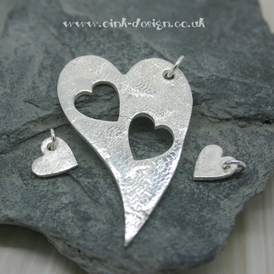 Mummy and Me. Three fine silver patterned heart pendants