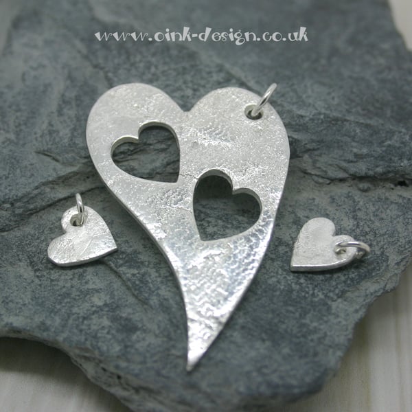 Mummy and Me. Three fine silver patterned heart pendants