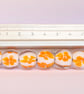 Handmade white and orange patterned lamp work glass beads - Image 4