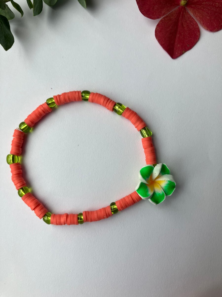 Coral clay-bead bracelet with GREEN Frangipani charm