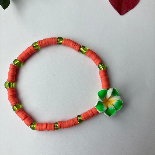 Coral clay-bead bracelet with GREEN Frangipani charm