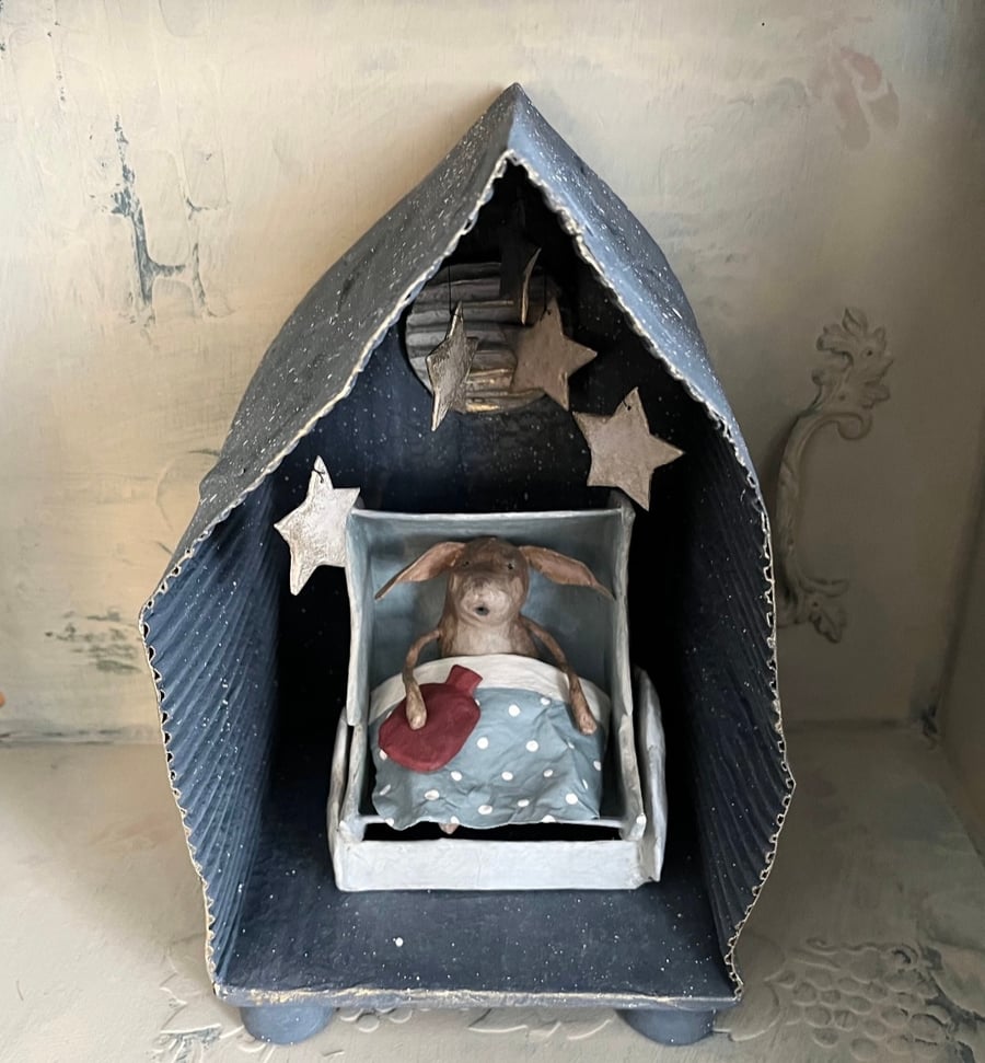 Paper mache hare in a handmade moon crib diorama