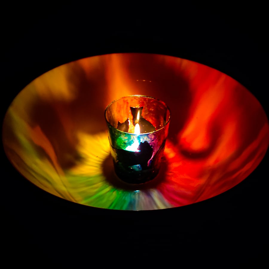 Painted glass candle holder with black cats silhouettes on rainbow background