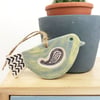 Ceramic bird decoration with patterned wing and tail 