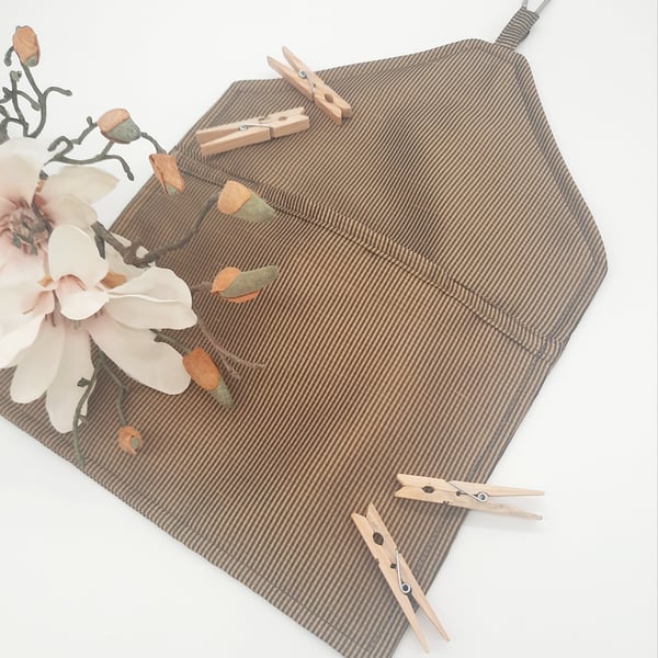 Black and gold vertical stripe clip on peg bag.