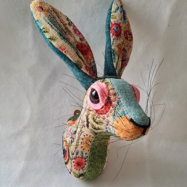 Faux hare head wall mount in floral tapestry fabric