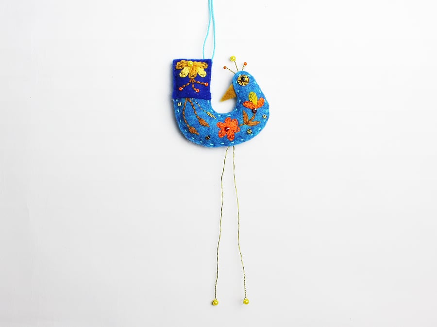 Icy blue coloured felt hanging bird ornament with folk embroidery