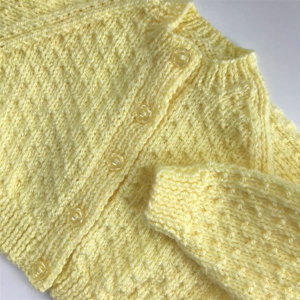 Hand knitted baby cardigan to fit 0-6 months in lemon