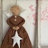Primitive angel with heart