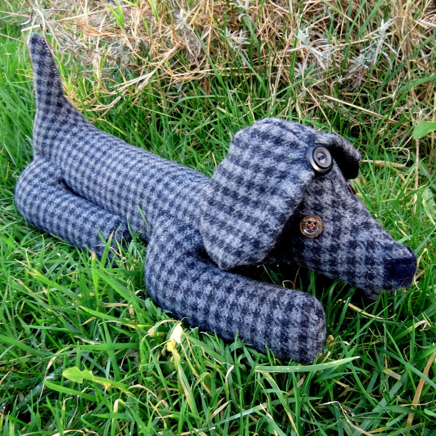 Basil, a soft tweed sausage dog doorstop.