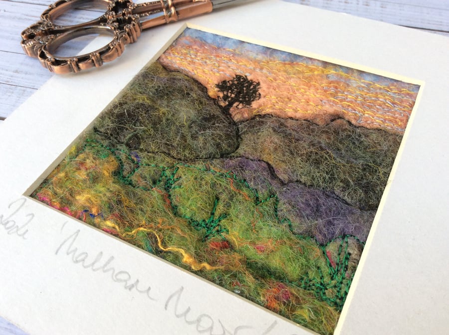 Embroidered wet felting landscape of Malham Moor with tree. 