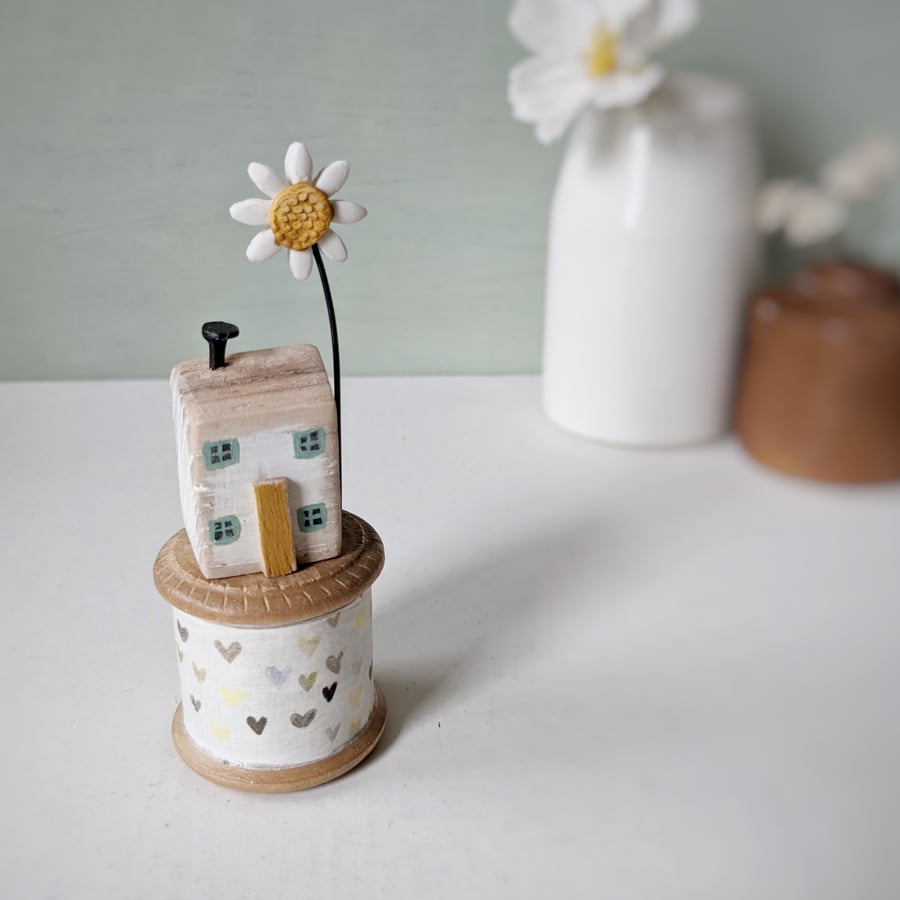 Wooden House on a Vintage Heart Bobbin with Clay Daisy