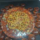 Beautiful round resin piece witrh gold arabic calligraphy ,golden flakes inside 
