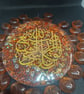 Beautiful round resin piece witrh gold arabic calligraphy ,golden flakes inside 
