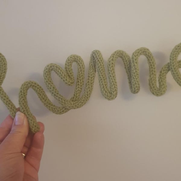 Knitted wire word,sign, motif