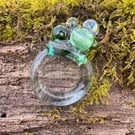 Glass Beads in Yellow, Green, Brown and Translucent on a Toxic-Free Resin Band. 