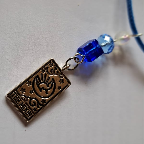 Tarot 'The Moon' pendant on a blue rope necklace