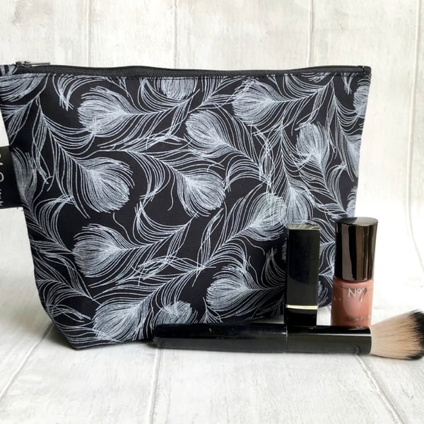 Makeup bags, black feathers