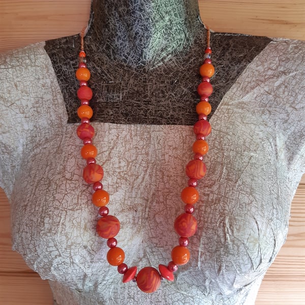 Bright orange and red longer length necklace