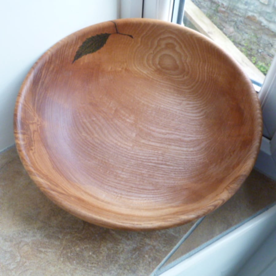 A  DEEPLY  FIGURED  ASH  BOWL