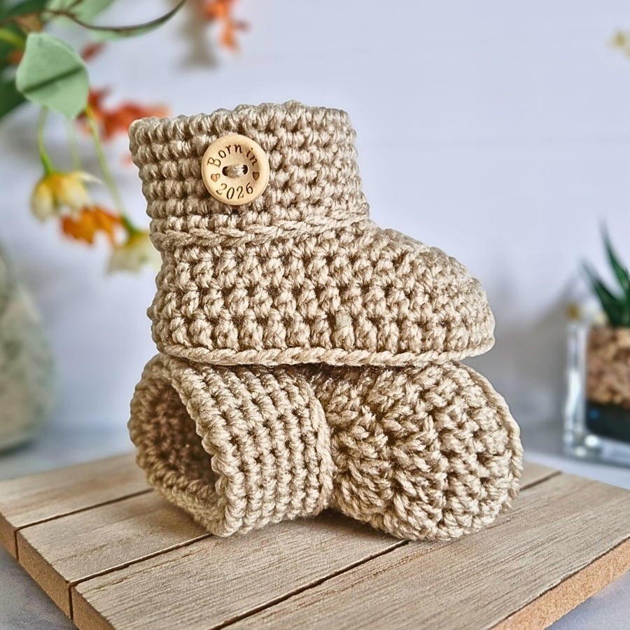 Crochet Baby Booties with 'Born in 2026' Button – Handmade Newborn Gift