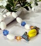 Colourful glass bead bracelet with extender chain. 