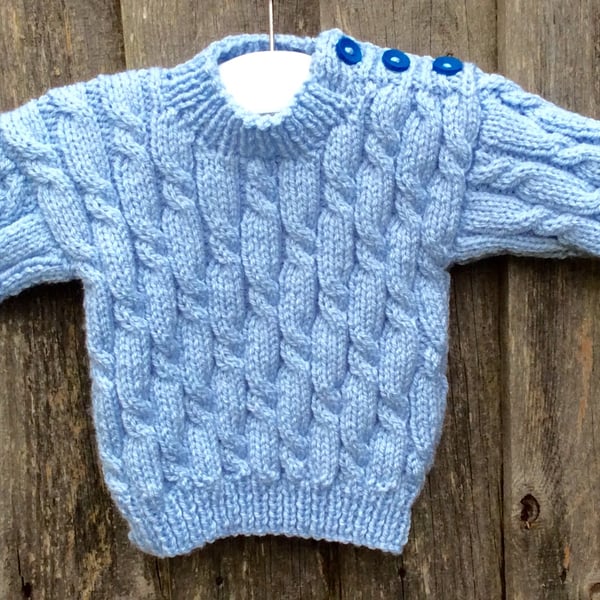 Hand knitted blue baby jumper