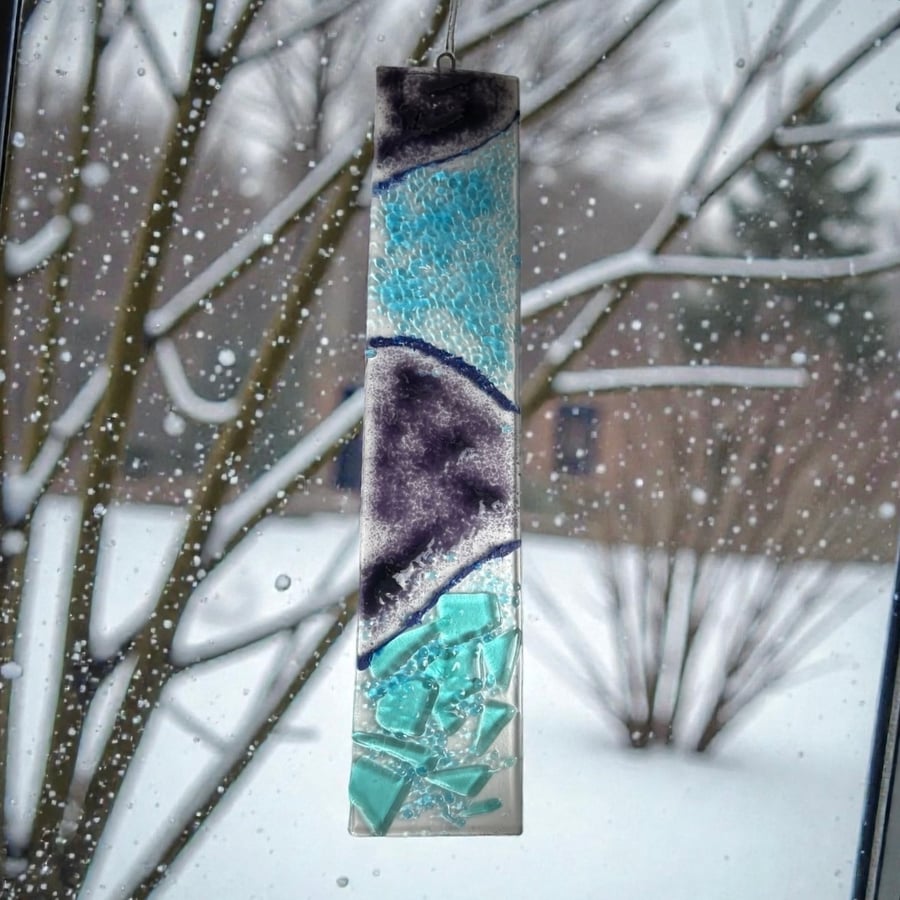 Handmade and unique fused glass sun catcher.