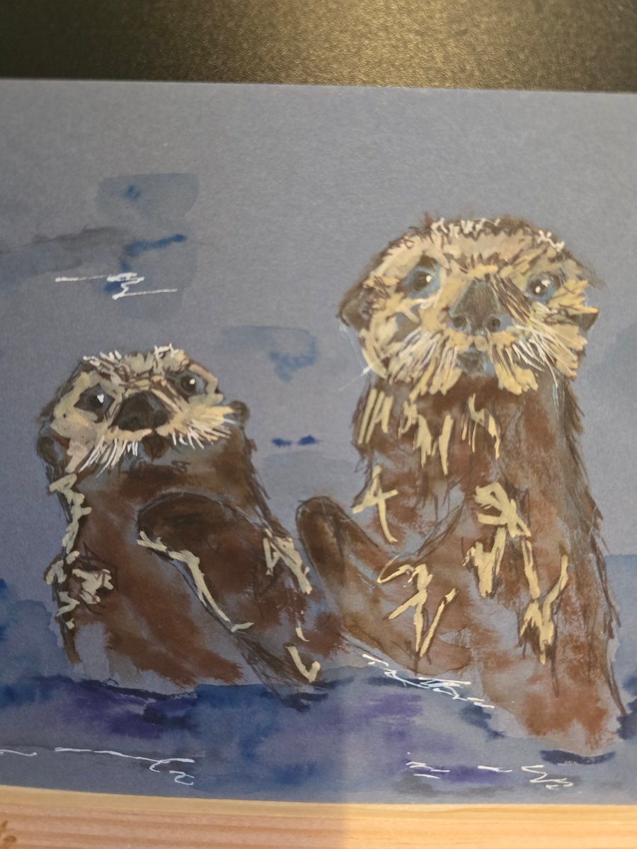Otters frolicking on A5 paper 