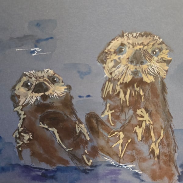 Otters frolicking on A5 paper 
