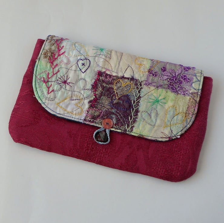 Raspberry pink sales clutch bag