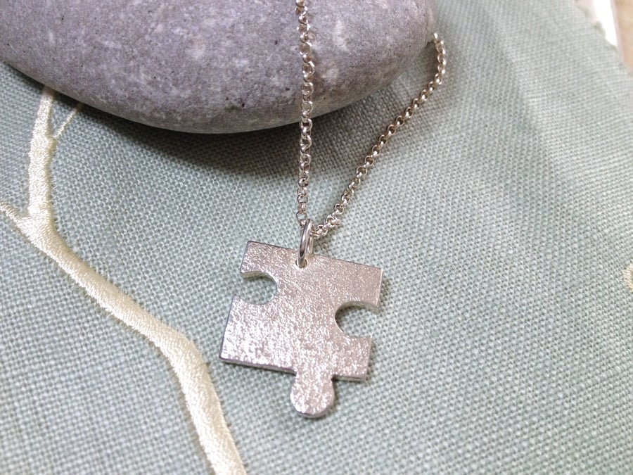 Sterling Silver Puzzle Piece Pendant Necklace. 