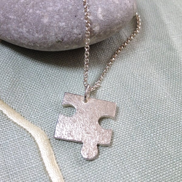 Sterling Silver Puzzle Piece Pendant Necklace. 