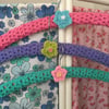 3 crochet covered hangers with crochet flowers
