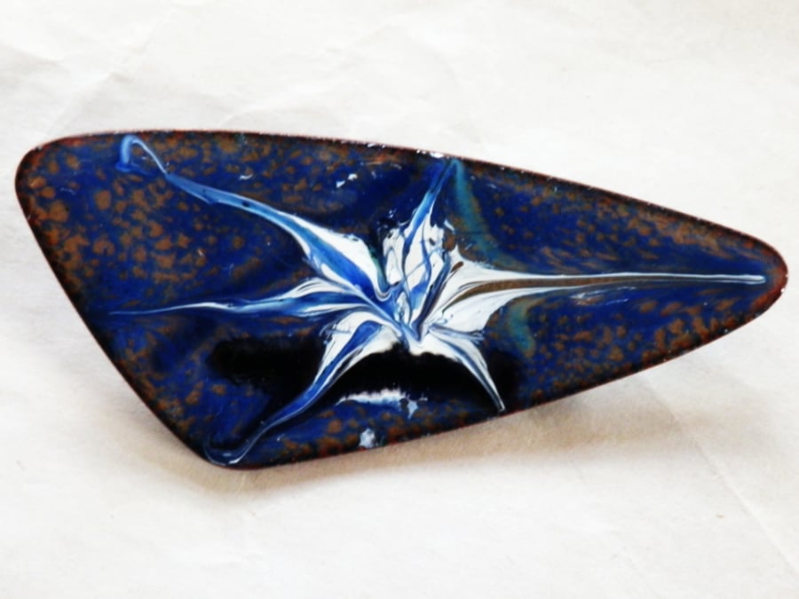 brooch - triangle scrolled blue, white and black over blue