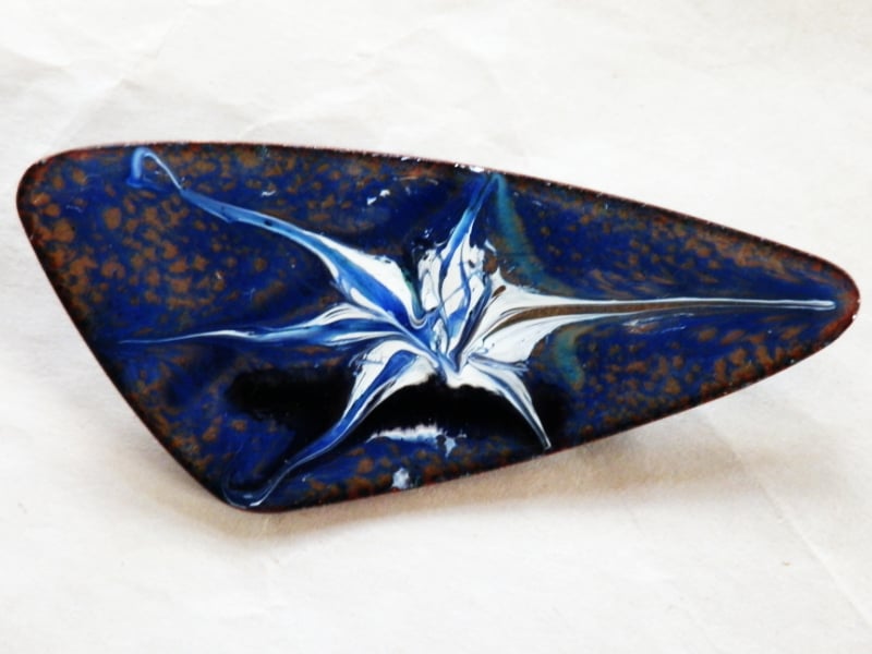 brooch - triangle scrolled blue, white and black over blue