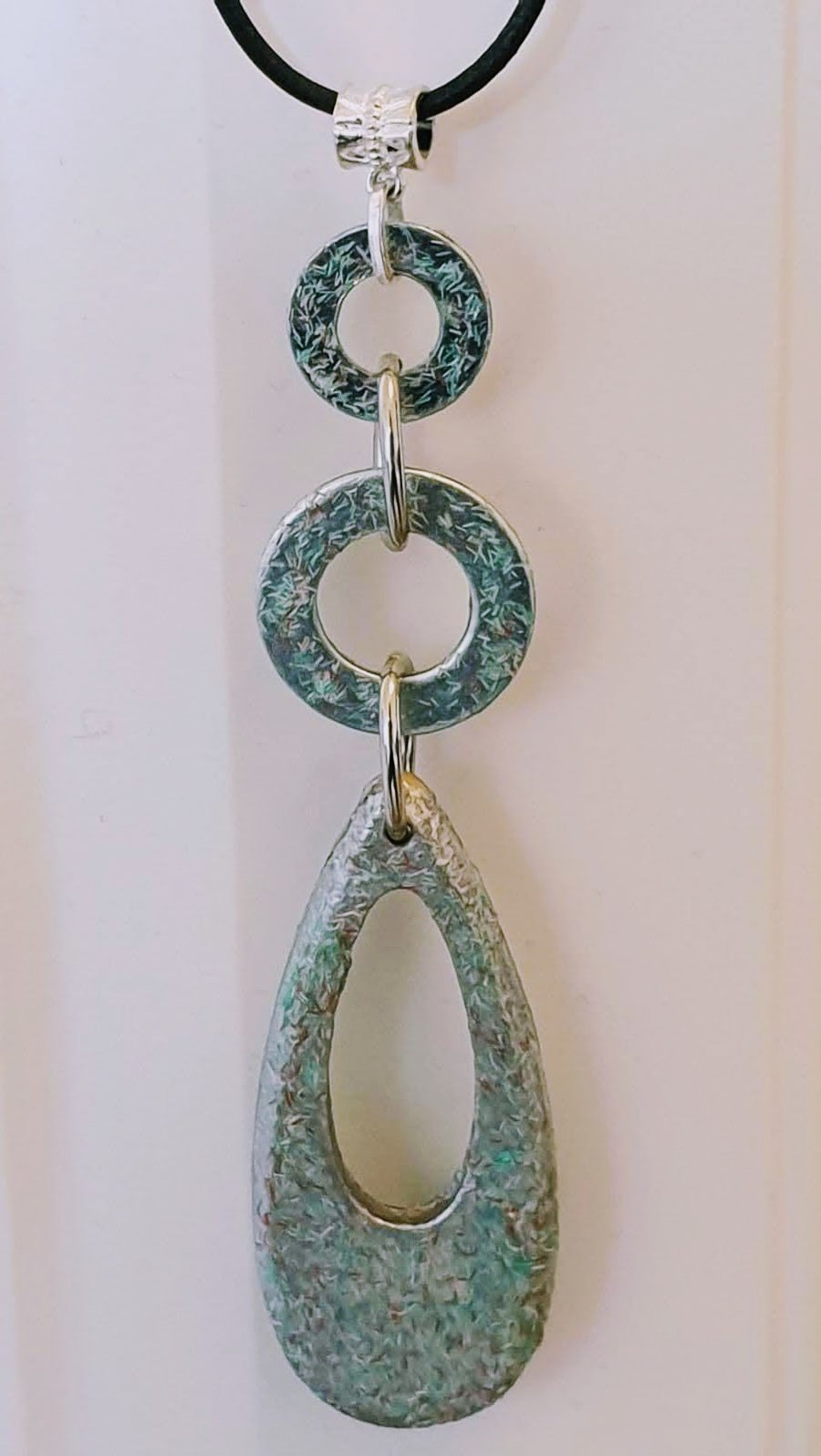 Modern wood pendant on leather cord