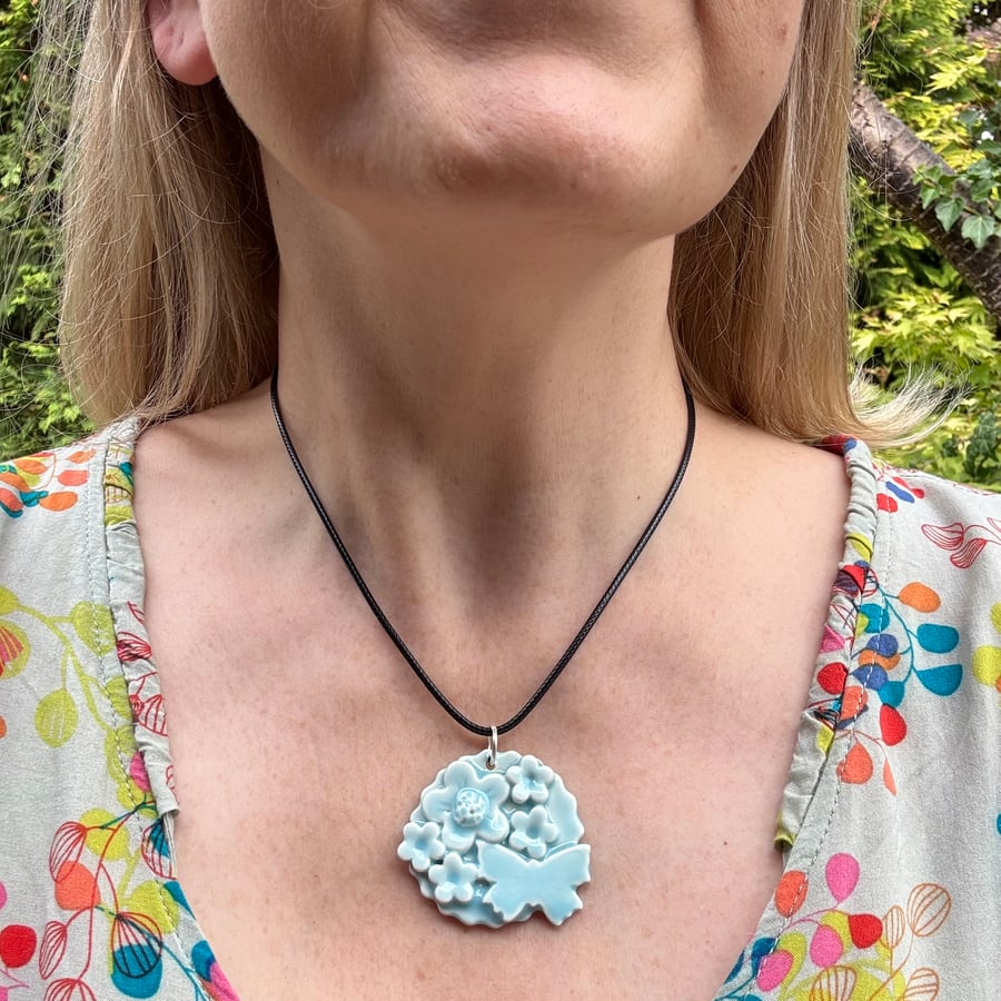 Glazed porcelain flower pendant - blue