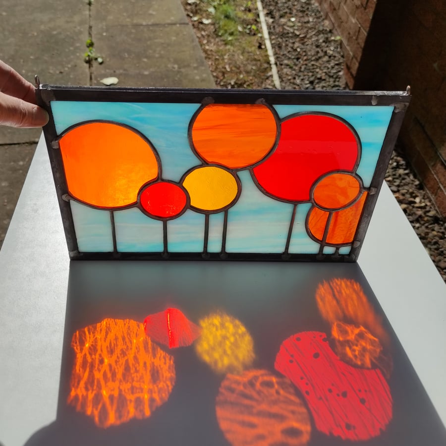 SOLD Orange lollipop flowers abstract stained glass panel. copperfoil and lead 
