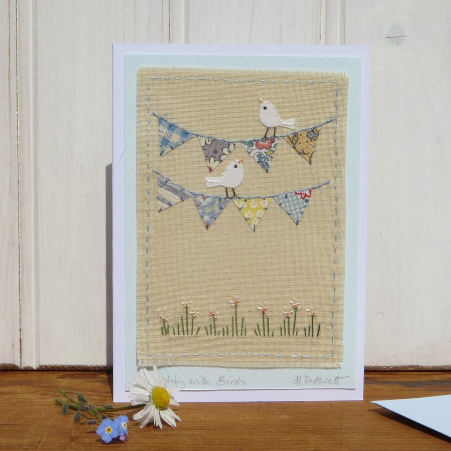 Hand-stitched mini bunting, little white doves, pretty card to keep!