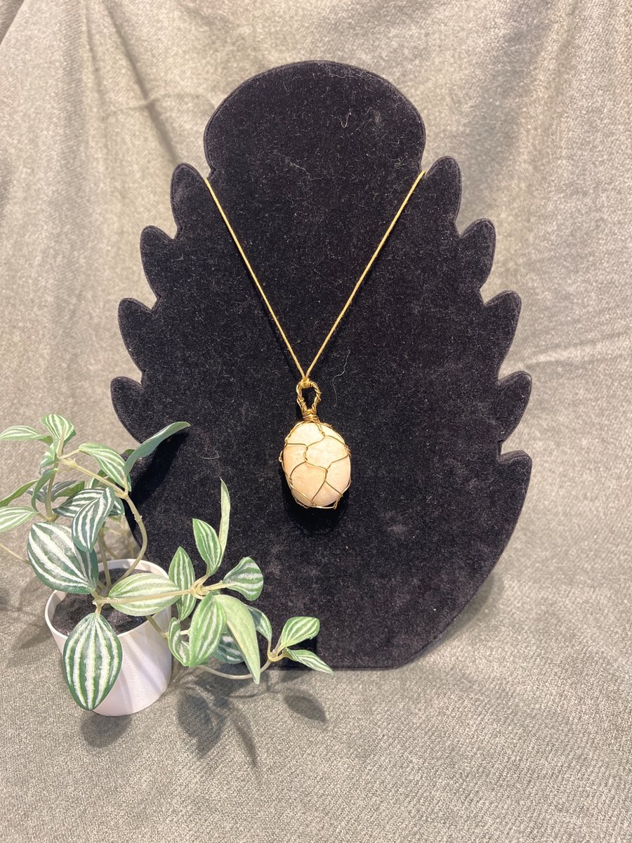 Beautiful wire wrapped white pebble pendant on adjustable olive green cord.  