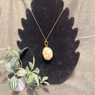 Beautiful wire wrapped white pebble pendant on adjustable olive green cord.  