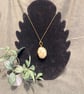 Beautiful wire wrapped white pebble pendant on adjustable olive green cord.  