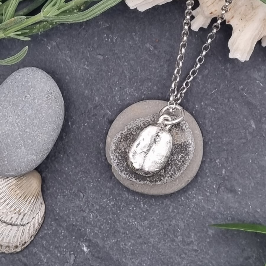Real coffee bean preserved in silver pendant necklace